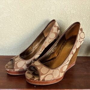 Cute and  comfortable wedged heel platform by Coach size 7 1/2.